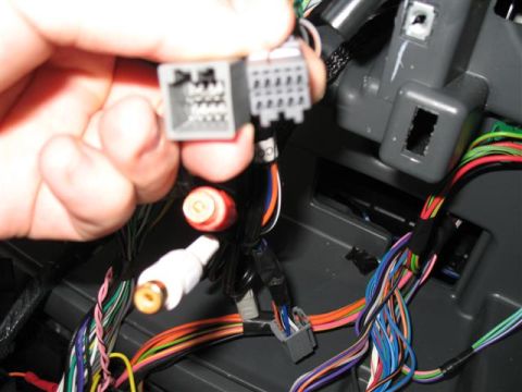 2008 Dodge 1500 - Second factory harness Plug set. The red and white RCA plugs are part of the LockPick adapter that allows you to run separate audio device…