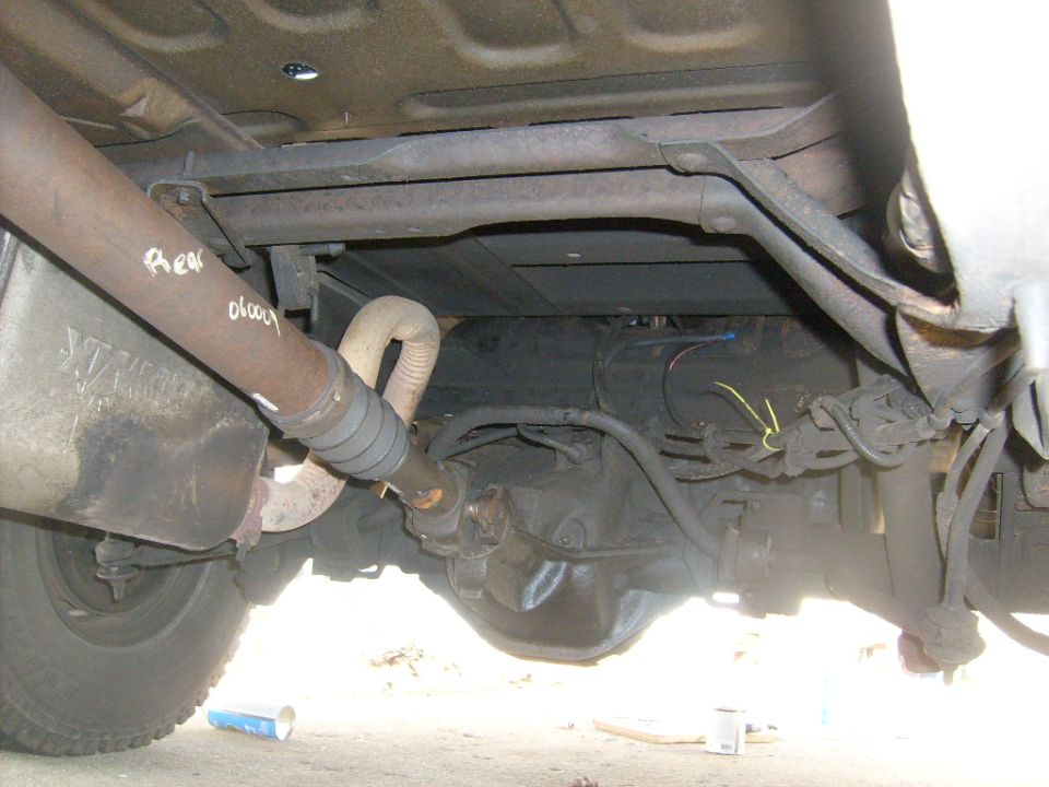 Undercarriage of Ford Bronco showing rear axle, driveshaft and exhaust