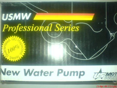 1992 Ford Crown Victoria - This is a close-up shot of the packaging for a USMW Professional Series New Water Pump. The box is black with yellow and orange stripes, an…