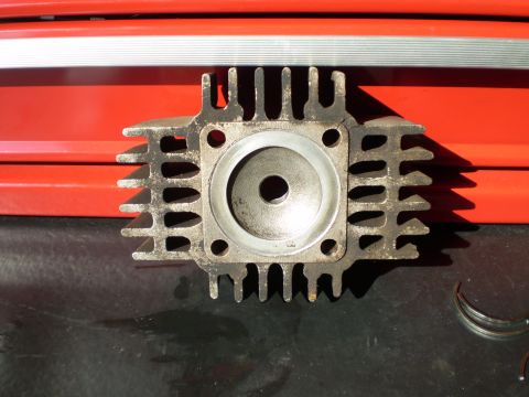 1981 Garelli Rally Sport - Engine cylinder head part shown in close-up, with a red toolbox in the background.