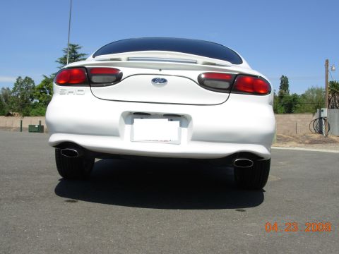 1995 Ford Taurus - Rear view of a white 1995 Ford Taurus showing taillights and exhaust.
