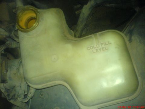 1992 Ford Crown Victoria - Coolant reservoir with 'COLD FILL LEVEL' markings visible.