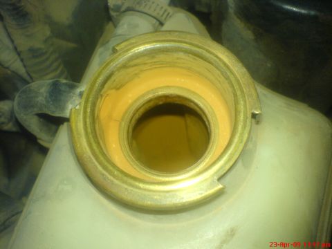 1992 Ford Crown Victoria - Radiator cap opening showing yellow residue, likely coolant.