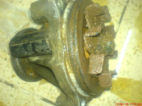 1992 Ford Crown Victoria - A heavily corroded fan clutch is shown, with visible rust and damage to its components.