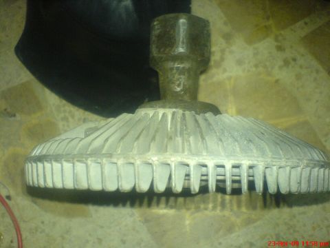 1992 Ford Crown Victoria - This is a fan clutch, a part used in vehicles to control fan speed.