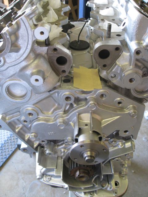 1994 Ford Probe - Close-up of a silver engine block, showing the water pump and timing gears.