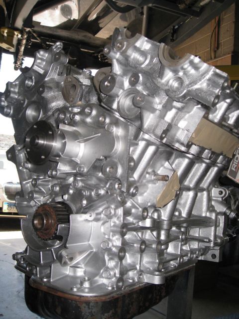 1994 Ford Probe - Close-up view of a silver engine block, showing intricate mechanical details and components.