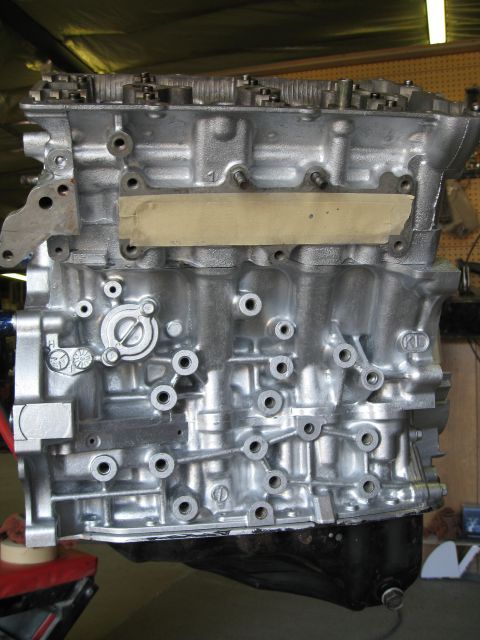 1994 Ford Probe - A close-up view of a silver engine block, likely undergoing maintenance or rebuilding.