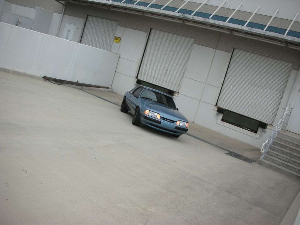 Blue 1990 Ford Mustang coupe, 3q front view