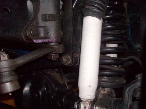 1978 Ford Bronco - Close-up of the front suspension system on a 1978 Ford Bronco, showing the shock and spring.