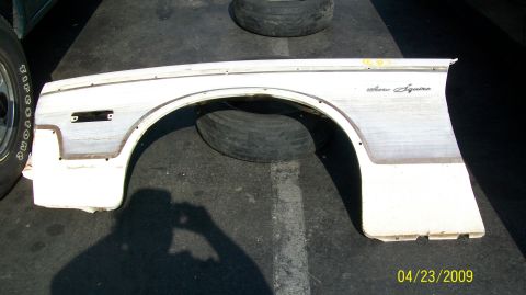 1972 Ford Ranchero - White Ford fender with "Aero Squire" script is shown on the ground.