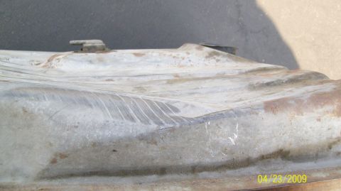 1972 Ford Ranchero - A close-up view of a damaged fuel tank, with the Supermotors.net logo visible in the lower right corner.