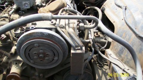 1972 Ford Ranchero - This image shows a detailed view of an engine compartment with various hoses and mechanical parts visible.
