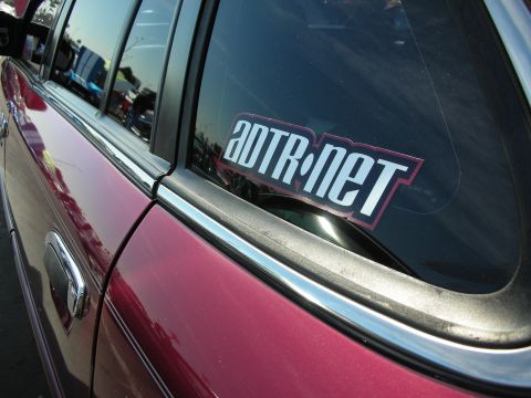 1992 Ford Crown Victoria - Side view of a car door and window an ADTR.net sticker.