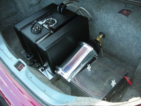 1992 Ford Crown Victoria - Aftermarket fuel cell and nitrous bottle installed in the trunk of a vehicle.