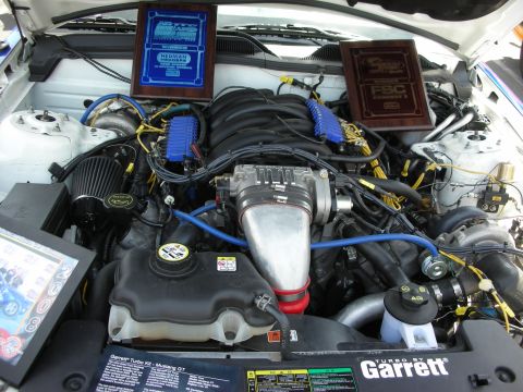 1992 Ford Crown Victoria - The engine bay displays two awards and a "Turbo by Garrett" label, indicating a modified vehicle.