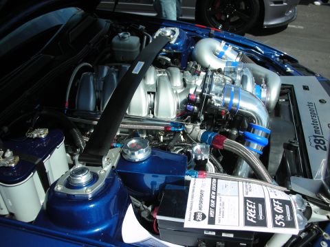 1992 Ford Crown Victoria - Customized engine bay polished components and turbochargers, with "281 Motorsports" branding visible on the strut tower.