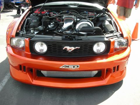 1992 Ford Crown Victoria - This modified Ford Mustang features a prominent turbocharger and intercooler under the open hood.