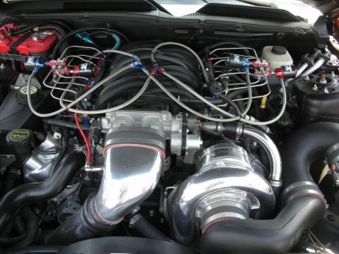 1992 Ford Crown Victoria - Engine bay details with a prominent Novi supercharger and custom fuel system.
