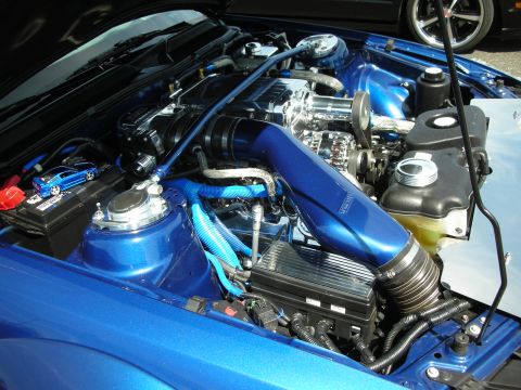1992 Ford Crown Victoria - The engine bay is meticulously detailed with blue accents and a prominent supercharger.