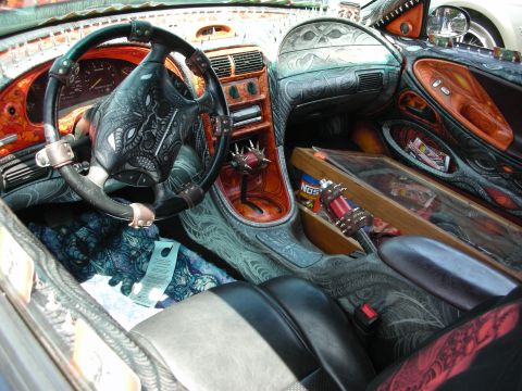 1992 Ford Crown Victoria - The interior of this car is heavily customized with intricate airbrushed designs and a NOS energy drink visible.