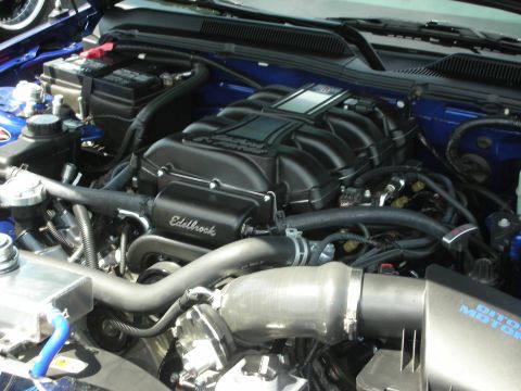 1992 Ford Crown Victoria - Close-up view of a modified engine bay, highlighting aftermarket components like a supercharger.