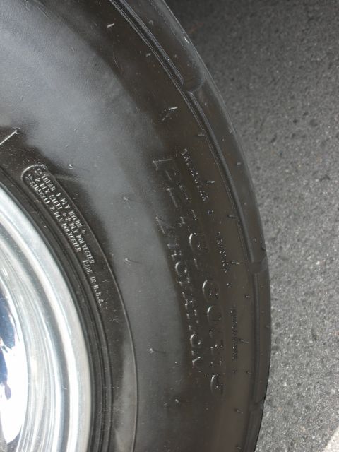 1992 Ford Crown Victoria - Close-up of a tire sidewall, showing manufacturer and size details.
