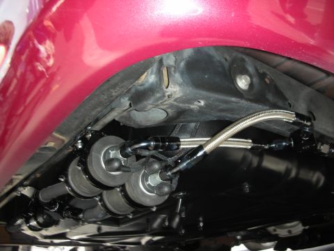 1992 Ford Crown Victoria - Underside view of a custom dual fuel filter setup with braided stainless steel lines.