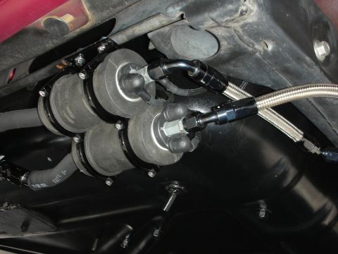 1992 Ford Crown Victoria - Underside view of a vehicle's fuel pump system, multiple pumps and braided fuel lines.