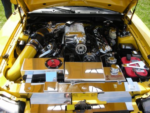 1992 Ford Crown Victoria - The engine bay features a polished supercharger and custom chrome covers, indicating performance modifications.