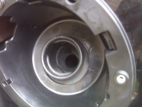 2008 Jeep Wrangler - The image shows the internal mechanism of a fuel filler neck, likely during a repair or installation.