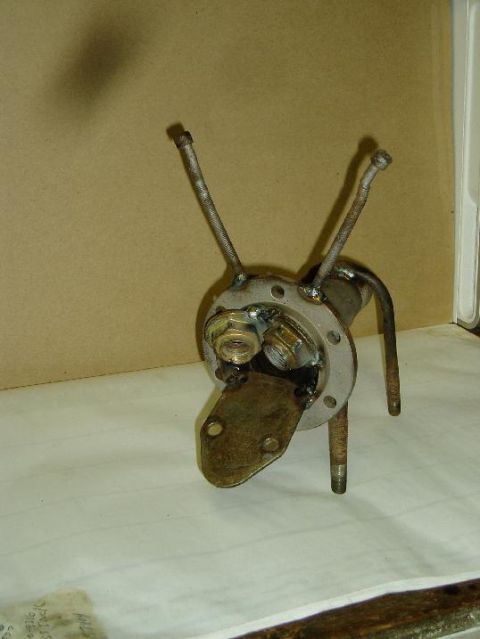 2000 Ford E350 - This metal sculpture, crafted from automotive parts, resembles a dog with antennae.
