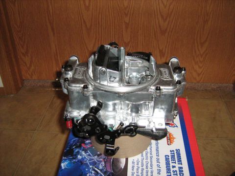 1988 Mercury Grand Marquis - A Summit carburetor is shown resting on a box with performance car graphics.