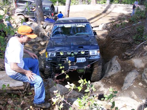 1991 Ford Bronco - This 1991 Ford Bronco tackles a challenging off-road course, with another Bronco in support.
