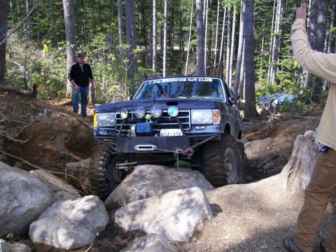 1991 Ford Bronco - Modified 1991 Ford Bronco tackles a challenging off-road course with friends.