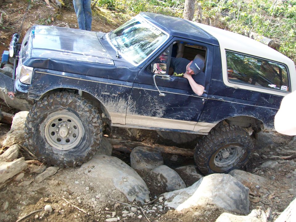 1991 Ford Bronco navigating a rocky trail