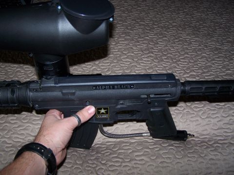 1986 Ford Bronco - A black paintball gun, labeled "ALPHA BLACK" and a U.S. Army insignia, is held by a person.