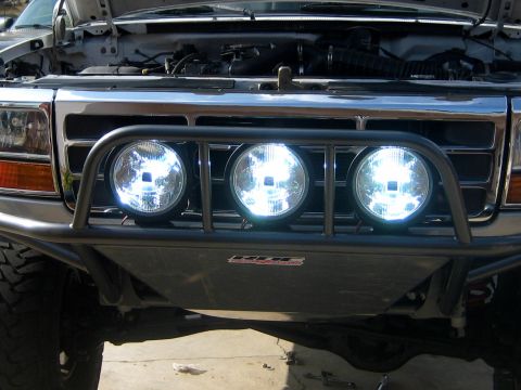 1996 Ford Bronco - Front view of a 1996 Ford Bronco showing its aftermarket bumper and KC lights.
