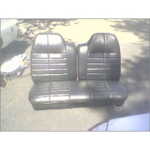 1972 Ford Ranchero - Pair of black vinyl car seats with horizontal pleating are shown outdoors.