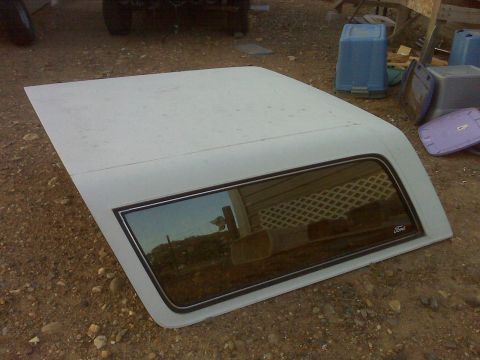 1989 Ford Bronco - This is a white hardtop for a 1989 Ford Bronco, a small Ford badge on the rear window.