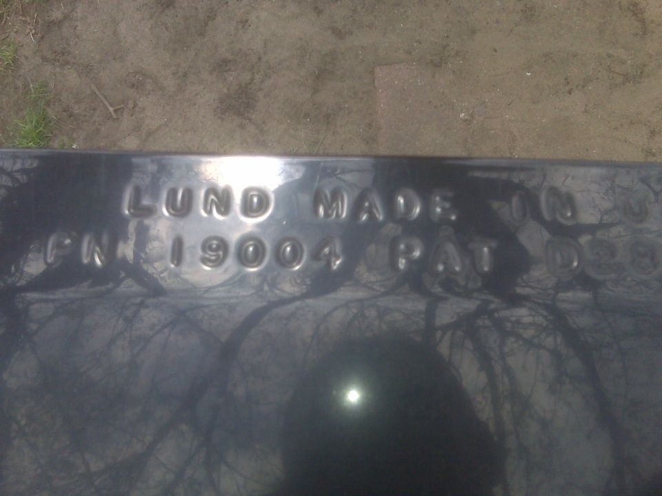 Embossed text on a metal part: LUND MADE IN PN 19004 PAT D28