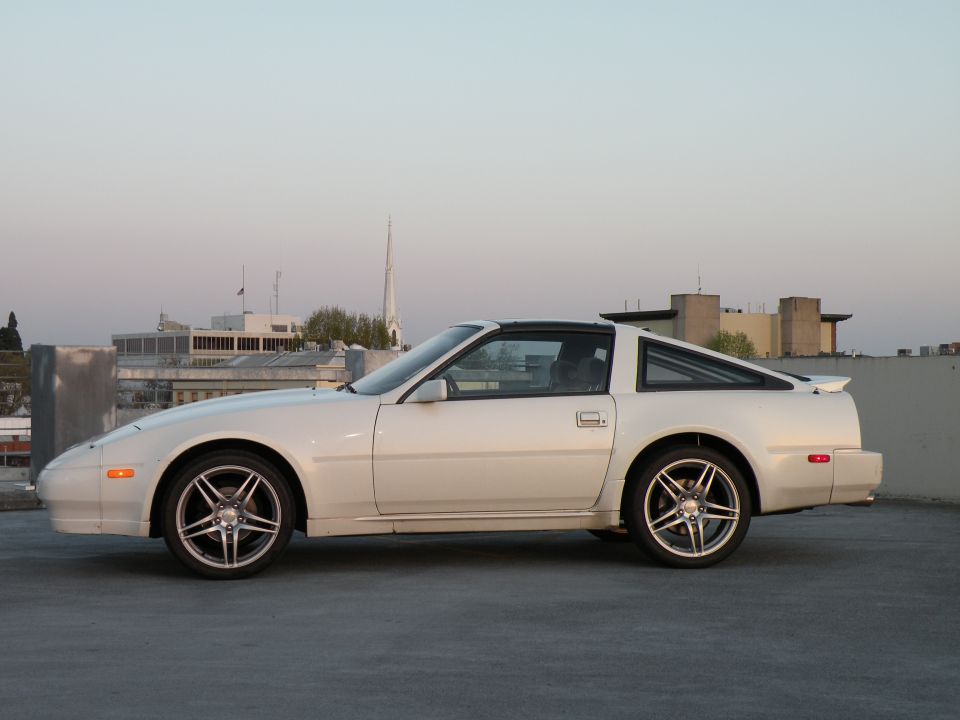 White Nissan 300ZX parked on a rooftop.
