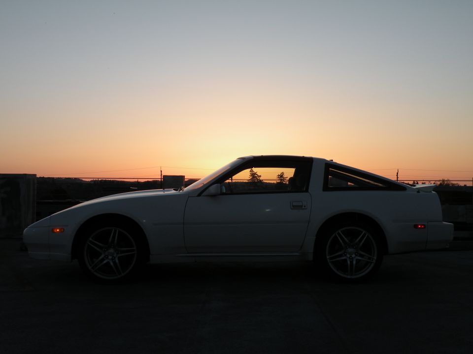 White Nissan 300ZX coupe side profile at sunset
