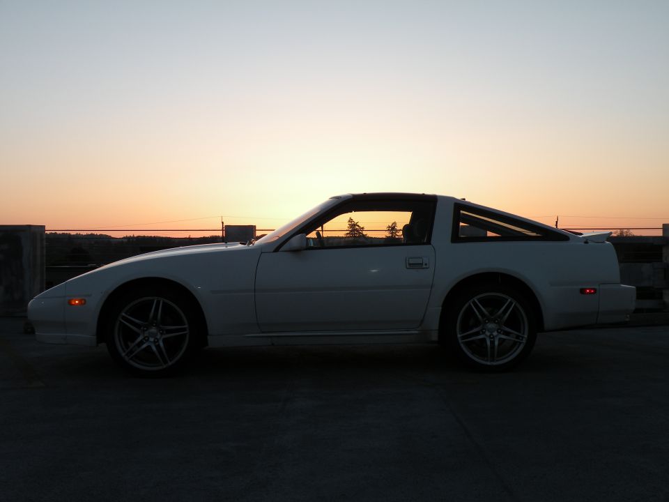 White 1989 Nissan 300ZX side profile at sunset.