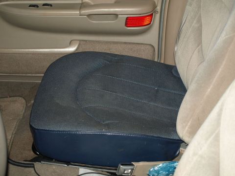 1999 Ford Crown Victoria - Close-up interior shot of a car seat and ceiling panel.