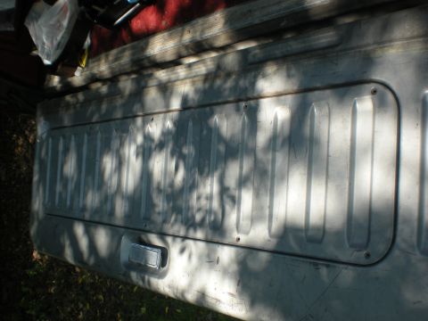 1990 Ford Bronco - Remove the tailgate access panel.