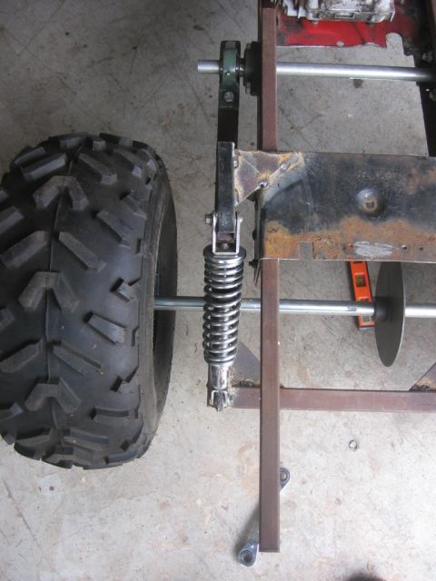 2001 Ford F-150 - The rear suspension and wheel assembly of a custom-built go-kart is shown in this close-up view.