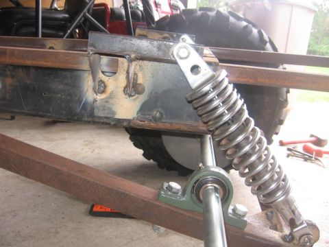 2001 Ford F-150 - Close-up of a custom vehicle frame, showing suspension components and construction details.