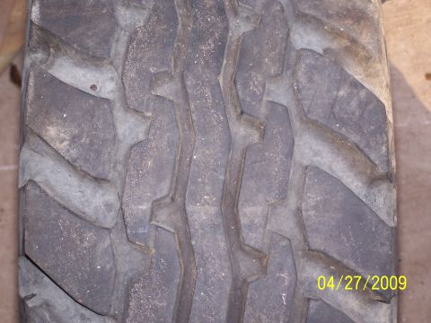 1989 Ford F-150 - A close-up view of a tire tread shows wear and a date stamp of 04/27/2009.