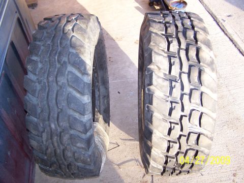 1989 Ford F-150 - A close-up view of two different off-road tires, their distinct tread patterns.